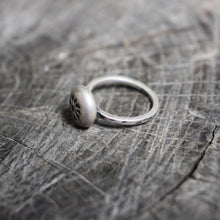 Load image into Gallery viewer, stamped flower on recycled silver river rock centerpiece