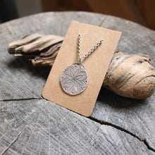 Load image into Gallery viewer, Pretty Eight petal flower stamped on silver disc necklace