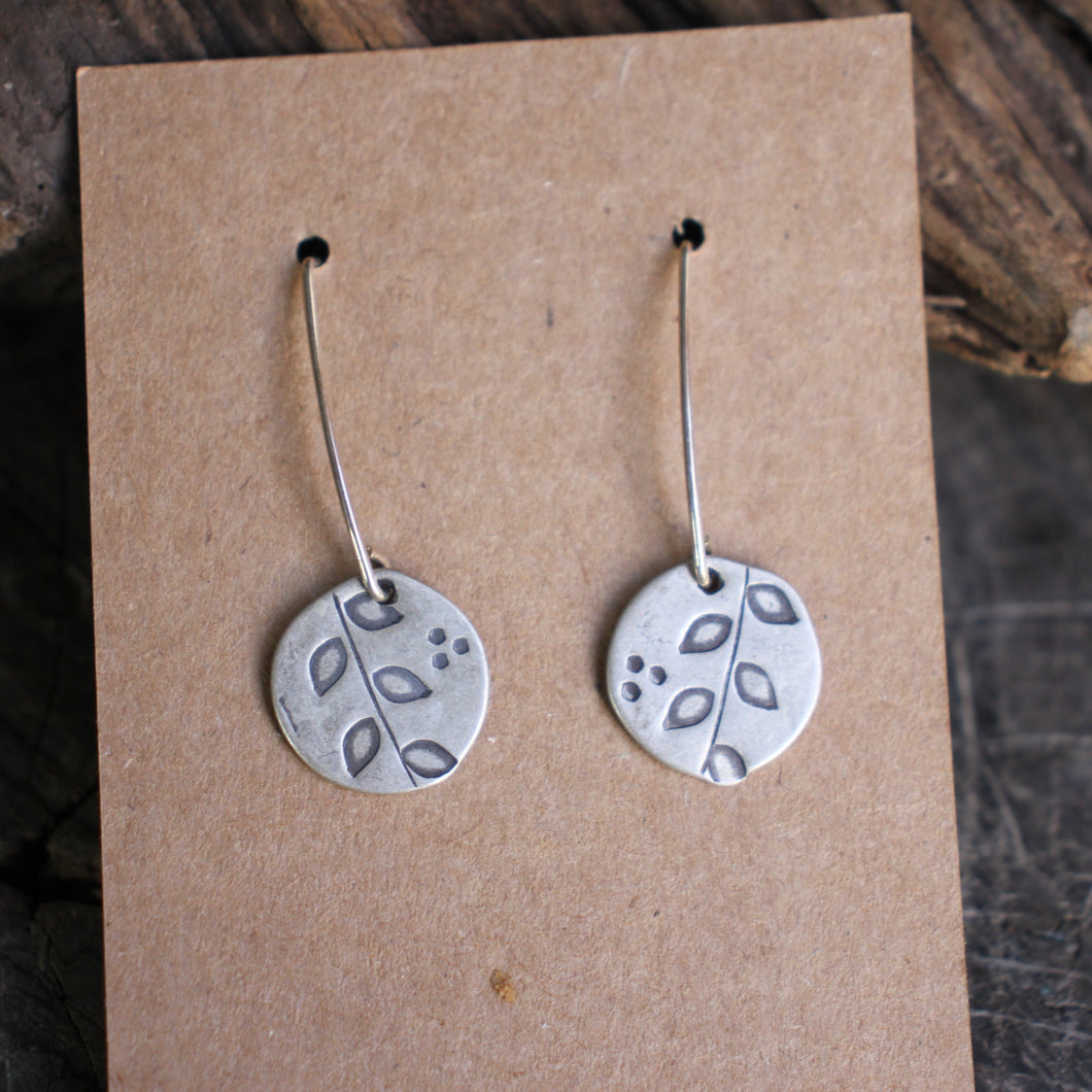 Branch with leaves stamped on silver disc Dangle earrings
