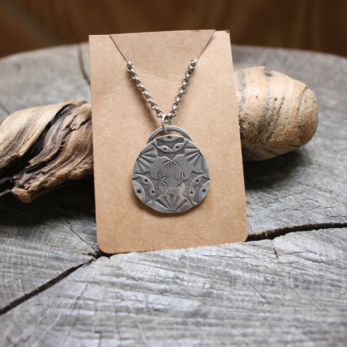 Sunrise mandala design stamped on sterling silver disc necklace